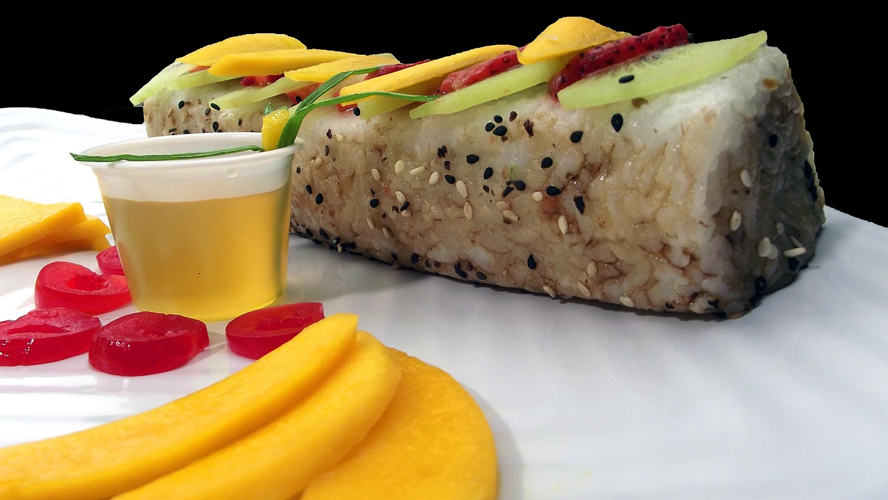 Sushi rolls topped with mango